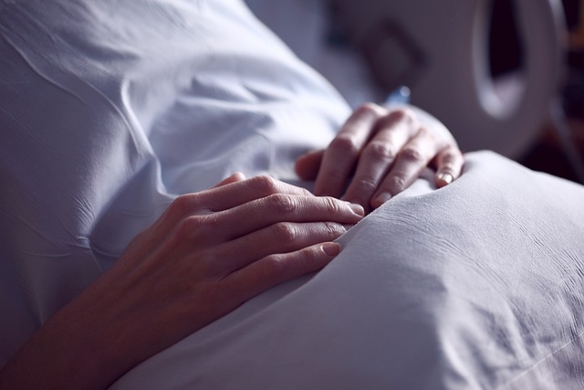 patient's hands resting on stomach