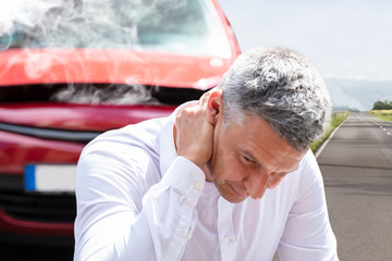 man with car accident neck injury
