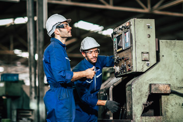 workers with heavy machinery