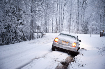 car off the road in snowy bank