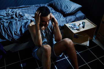 distressed person sitting on ground