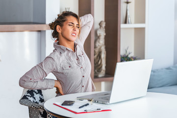 woman with neck pain at desk