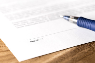 pen and signature line on settlement offer