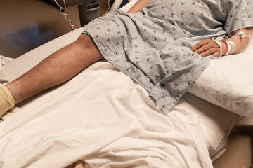 man with amputated leg on hospital bed